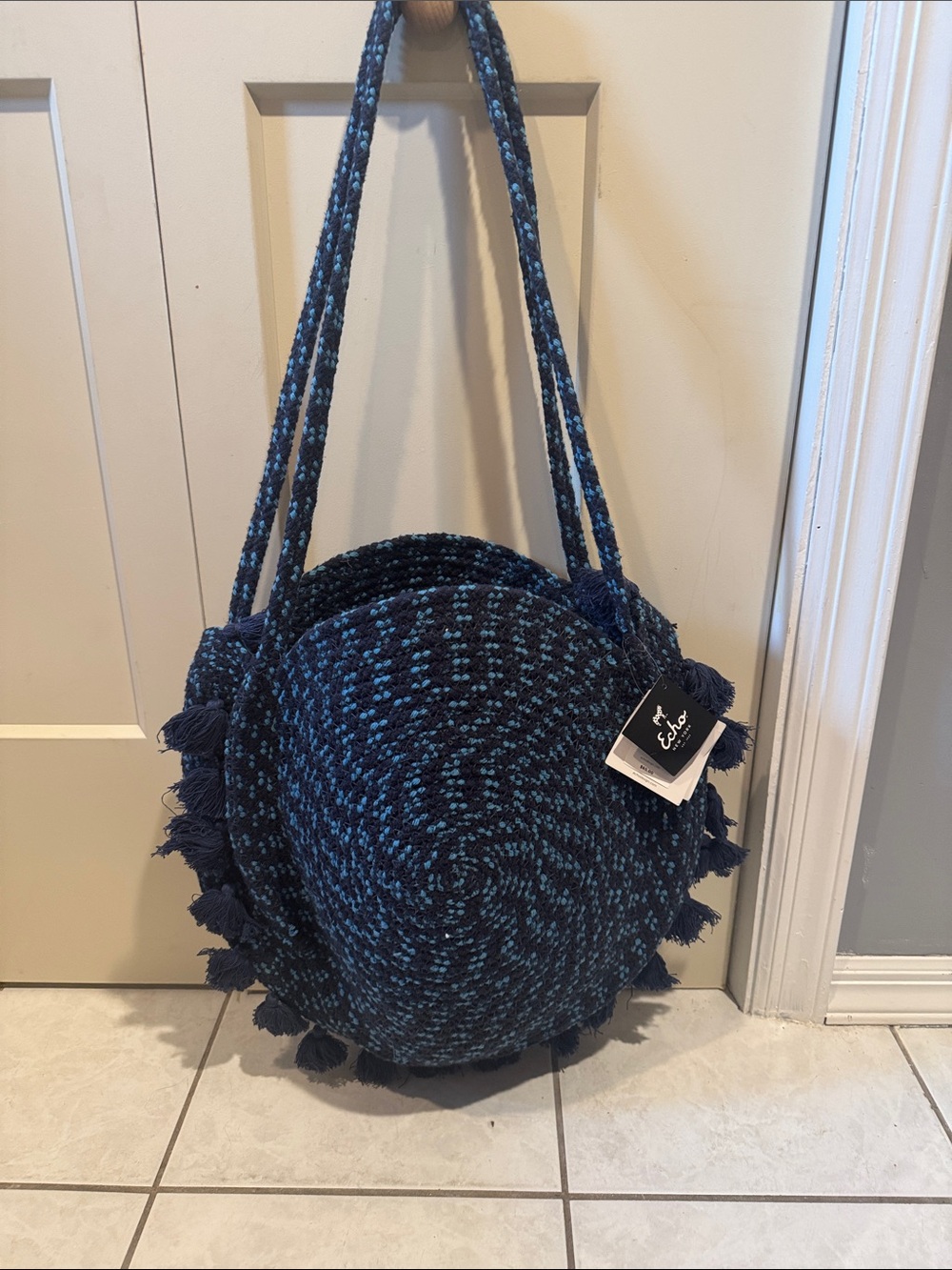 Echo Round Woven Crossbody Bag in Navy and Teal with Tassels